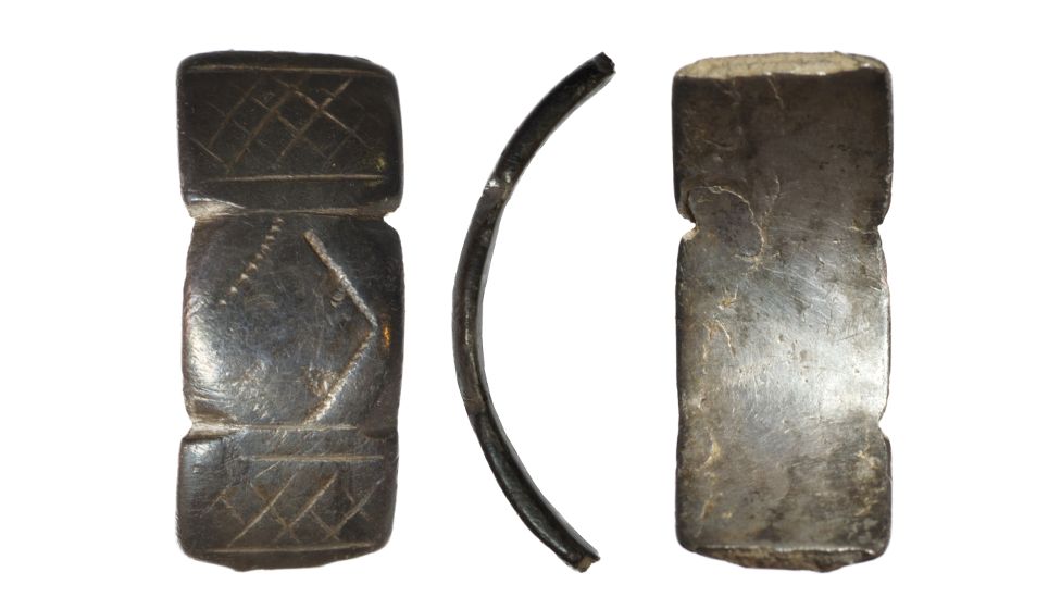 A medieval silver ring fragment (Treasure Case 22.39), discovered by Jamie Larkin on 10th August 2022 in a field under arable in Llandegla Community, Denbighshire, during a metal-detecting rally. The ring, with repeating incised decoration and panelled design, probably dates to the 15th century. Denbighshire Museums Service has expressed an interest in acquiring the ring for its collection.