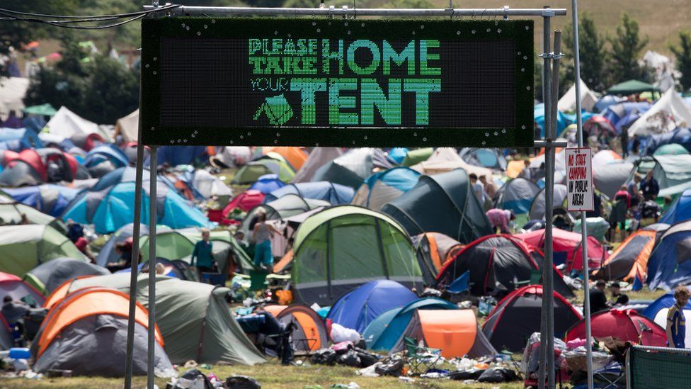 "Please take home your tent" sign at Glastonbury