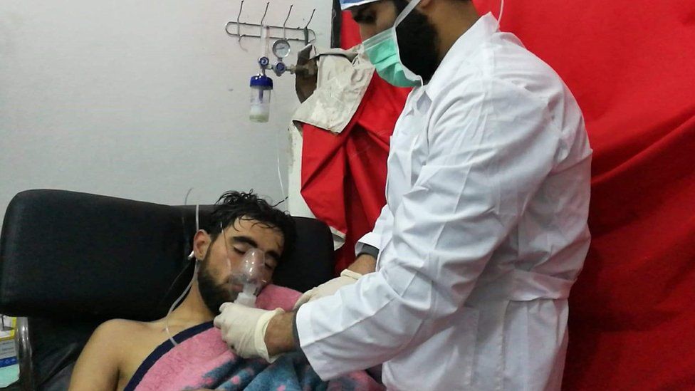 A man is treated by a medic after an attack allegedly involving chlorine in Saraqeb, Syria, on 4 February 2018