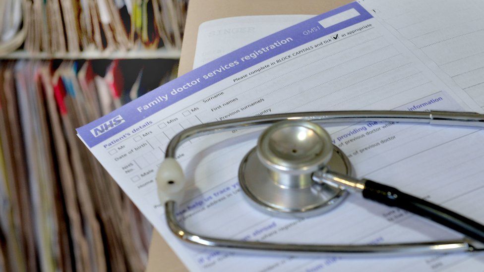 A stethoscope on a patient GP form