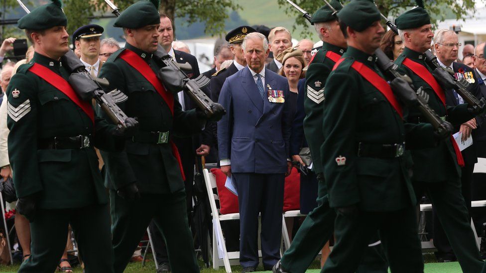 Prince Charles watches soldiers at the Ulster Tower in Thiepval