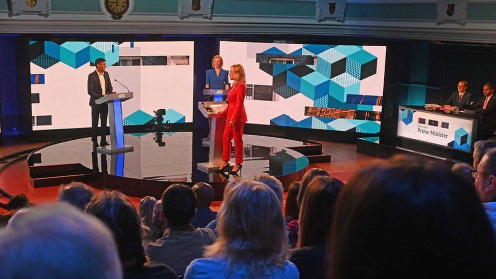 Rishi Sunak, Liz Truss, and moderator Sophie Raworth on stage at the BBC leadership debate