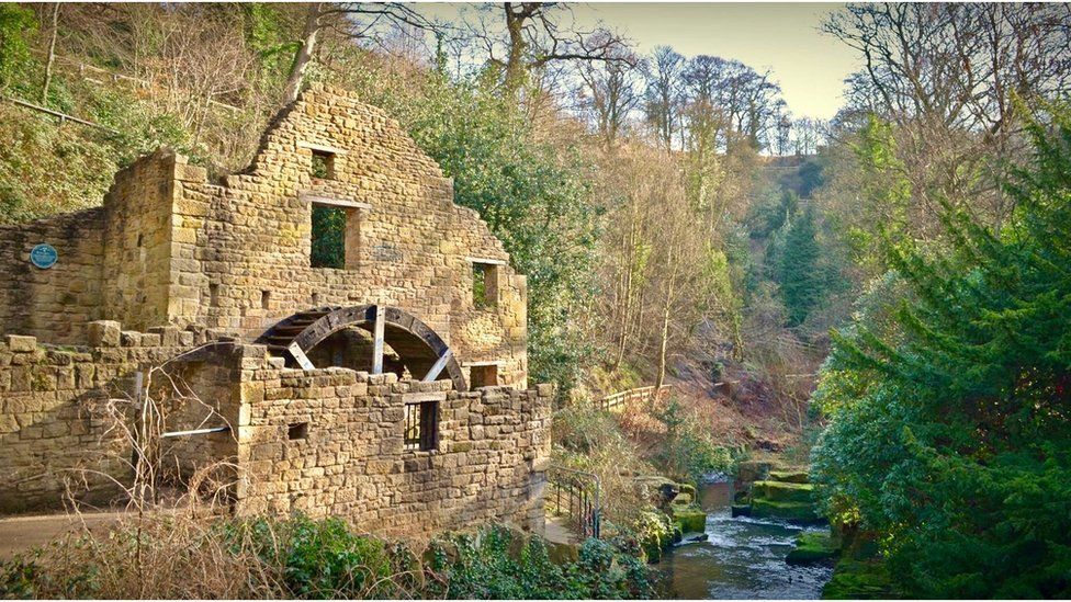 An old mill by a river