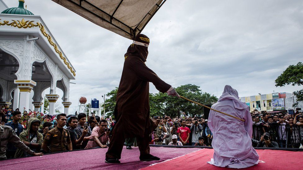 Woman being caned