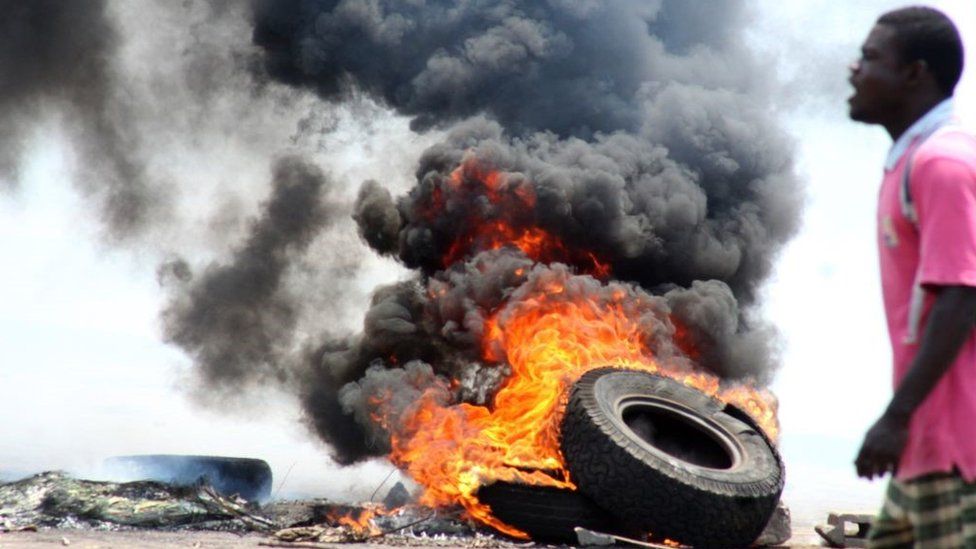 Protesters burns tyres as they block the streets during a demonstration in demand of reform in Lome, Togo on September 8, 2017