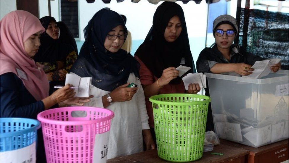 Electoral officials count votes at a polling station in Bangkok on March 24, 2019 after polls closed in Thailand's general election.