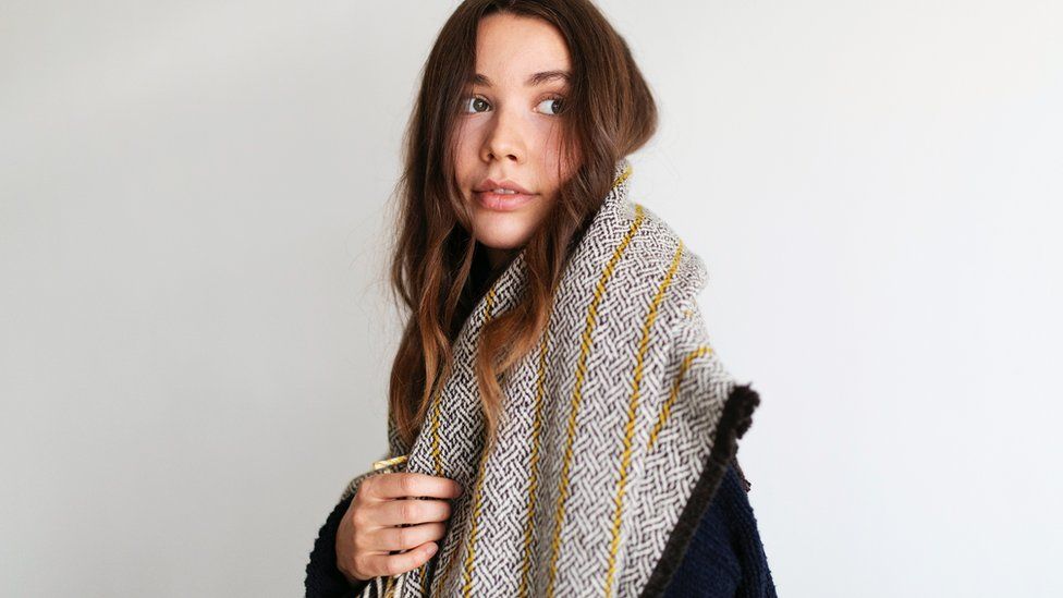 A model wearing a Bristol Cloth Project scarf