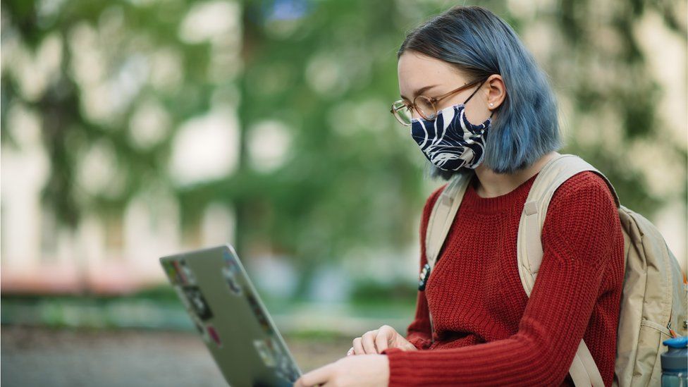 A student wearing a mask