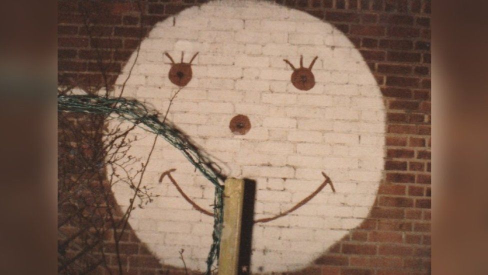 Smiley face on wall