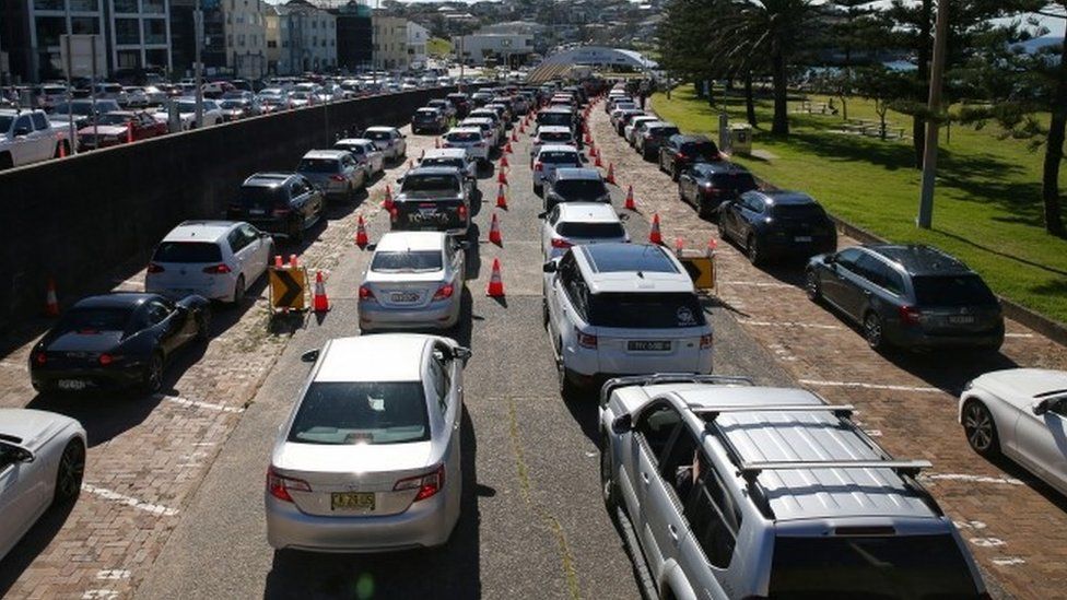 Scores of cars queue for Covid tests at Sydney's Bondi Beach