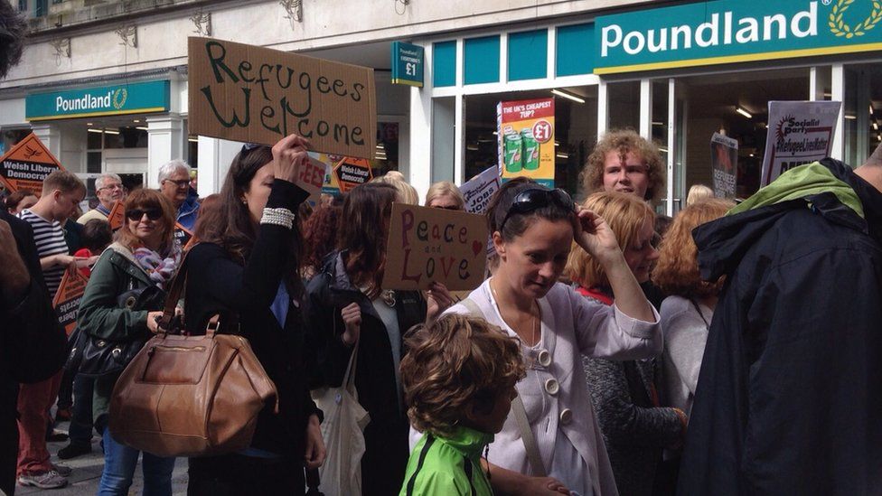 Demonstrators take to streets to say 'refugees welcome' in Wales - BBC News