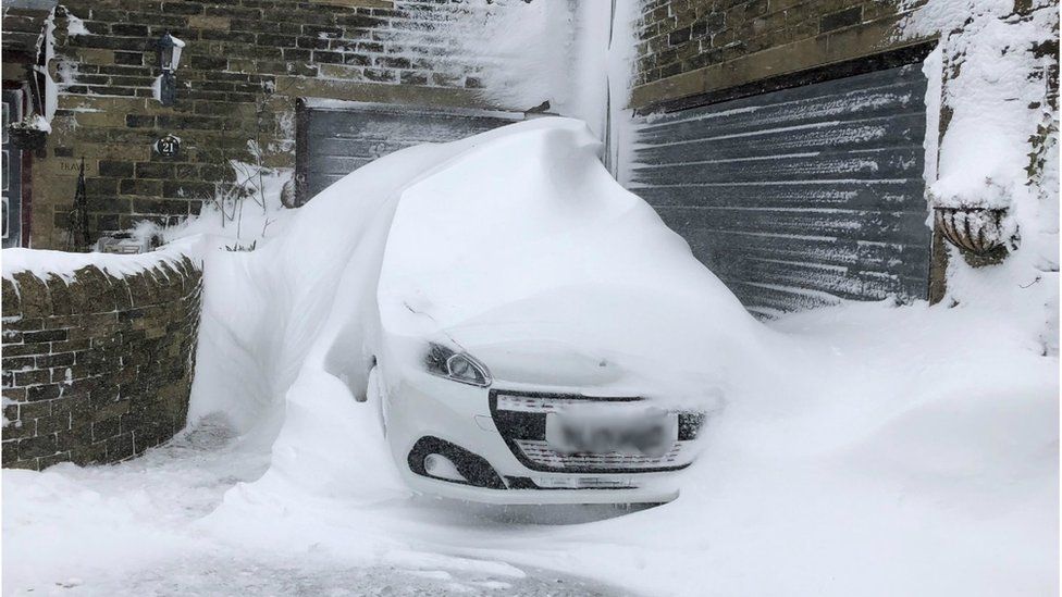 A snowed-in car