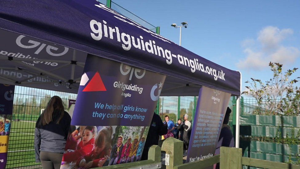 Purple girlguiding gazebo with various posters about guiding