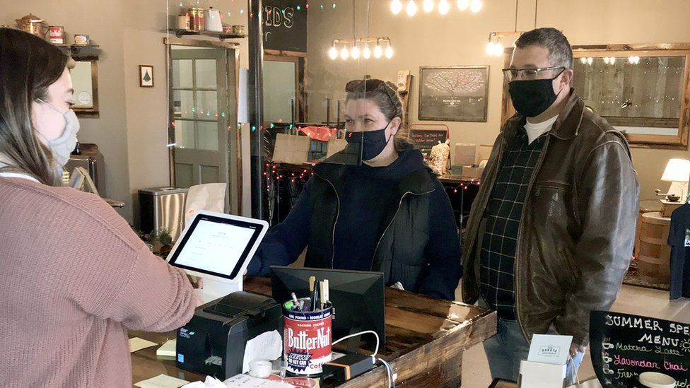 Mask-wearing customers at a coffee shop in Brookings
