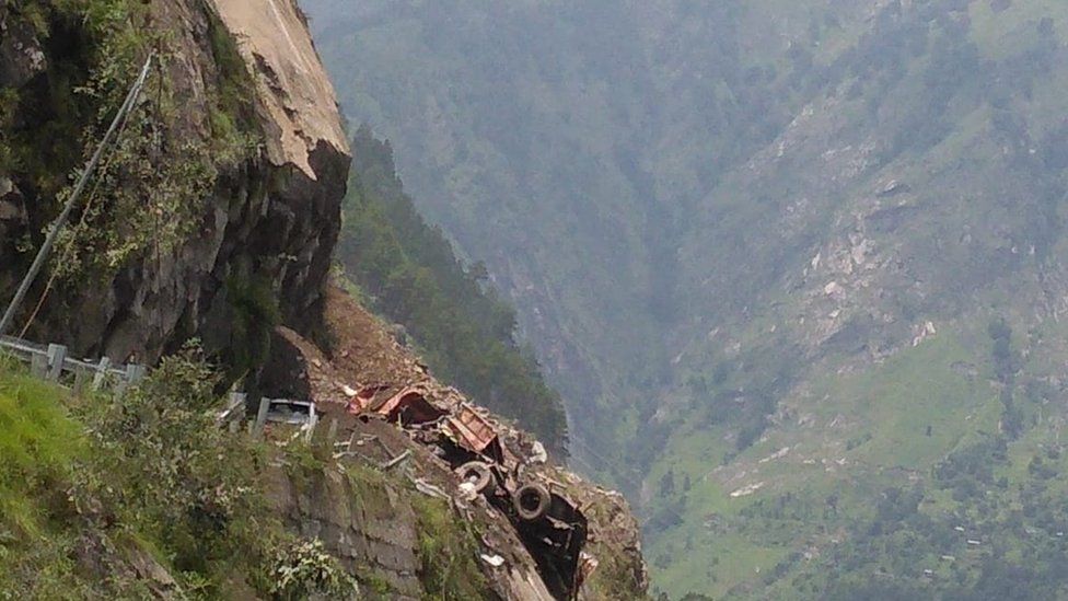 A truck hit by a landslide