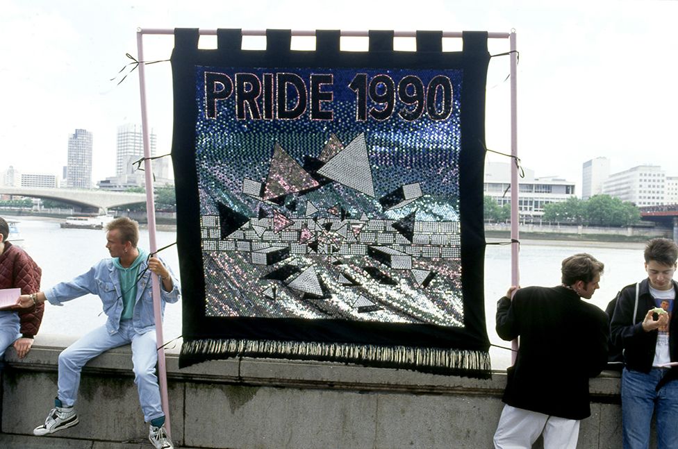 People attend the Pride march in 1990
