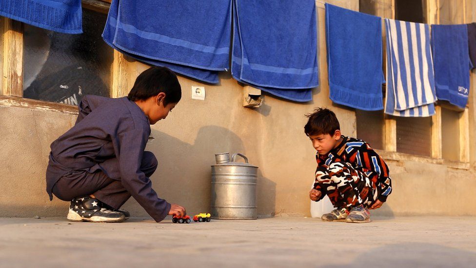 Murtaza Ahmadi, a young fan of Barcelona star Lionel Messi, plays with a friend in Kabul, Afghanistan, 03 December 2018