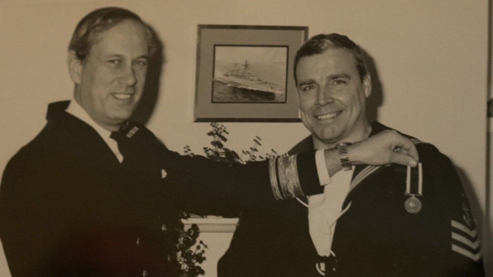 A black & white photo of Joe Ousalice being awarded military medals