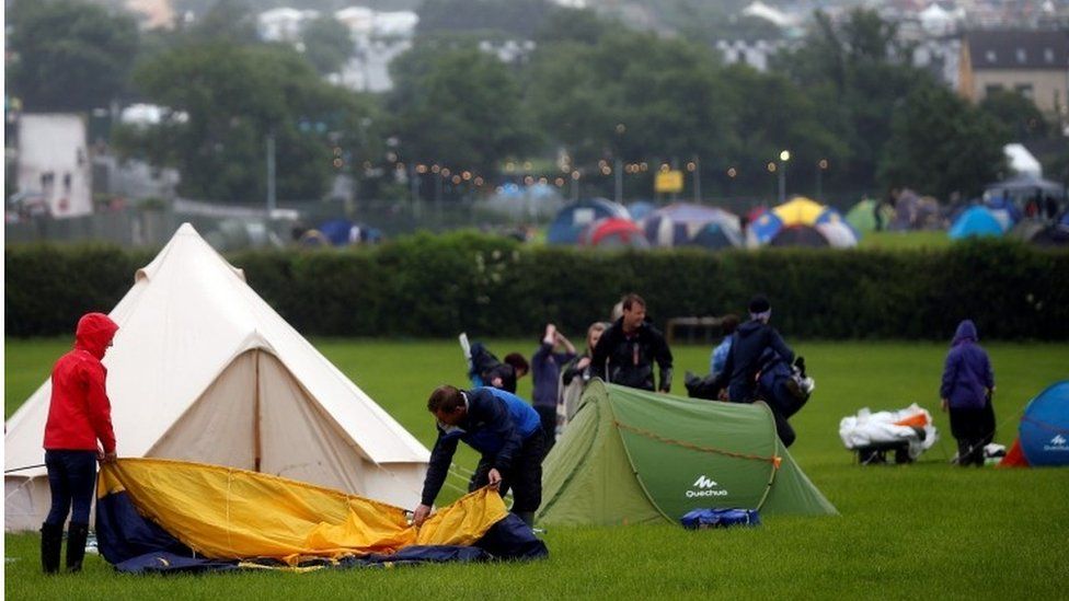 Revellers set up tent