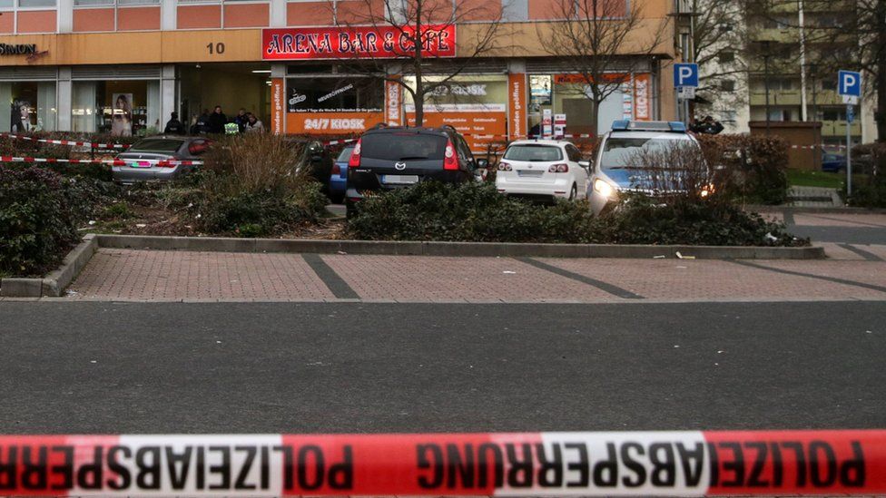Police barrier tape flutters in front of the Arena shisha bar, one of two crime scenes after two shootings in Hanau