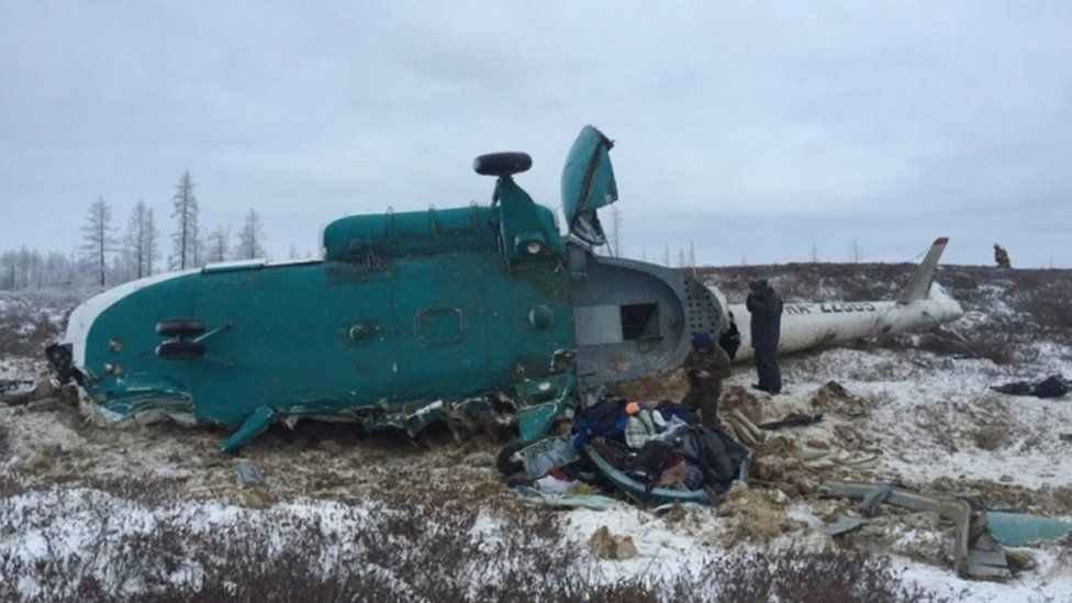 Crashed helicopter lying on a field