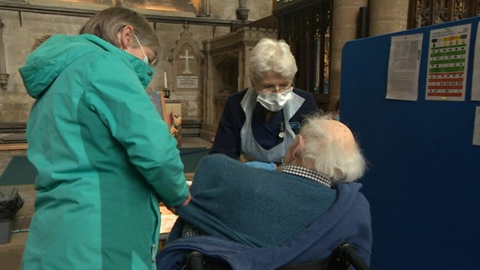 A man gets the vaccine at Salisbury Cathedral