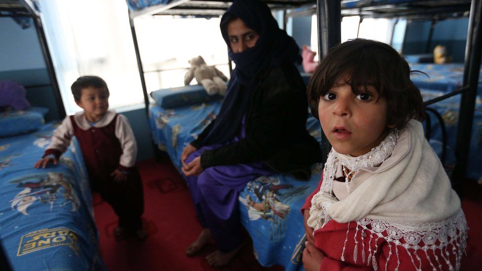 Afghan drug addict woman sits along with her children at Addiction Recovery Center (ARC) in Herat, Afghanistan