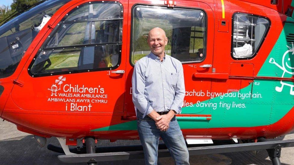 Brendan Clancy with a Wales Air Ambulance photo