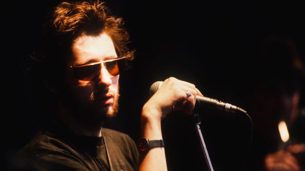 Shane MacGowan performing