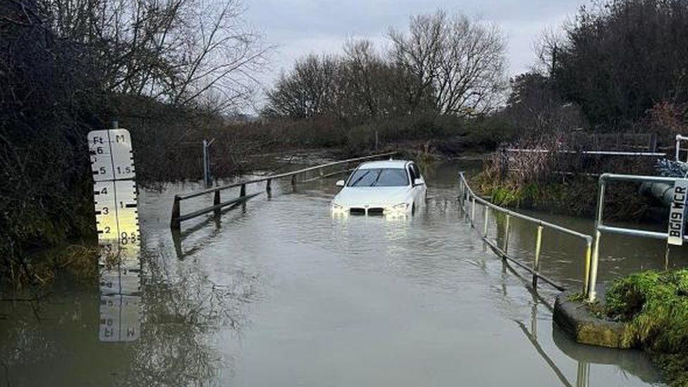 Car stranded in flood water