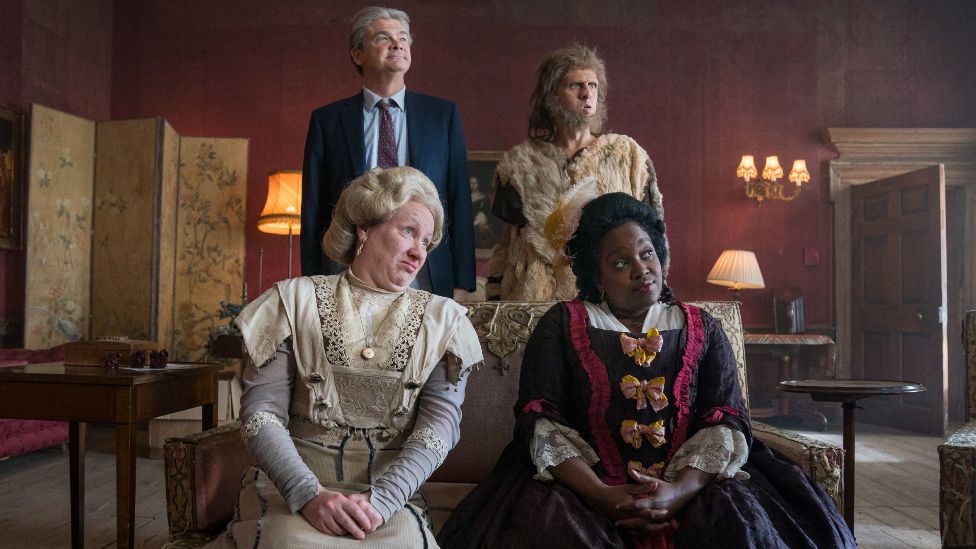 Lady Button (played by Martha Howe-Douglas), Julian (Simon Farnaby), Robin (Larry Rickard) and Kitty (Lolly Adefope), in the fifth series of Ghosts