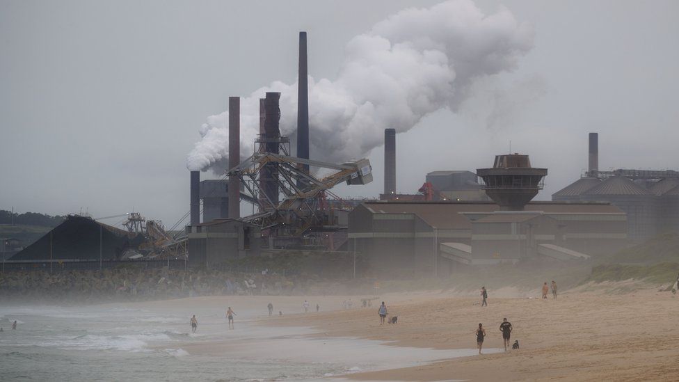 Coal station at Port Kembla billowing carbon pollution out onto the beach