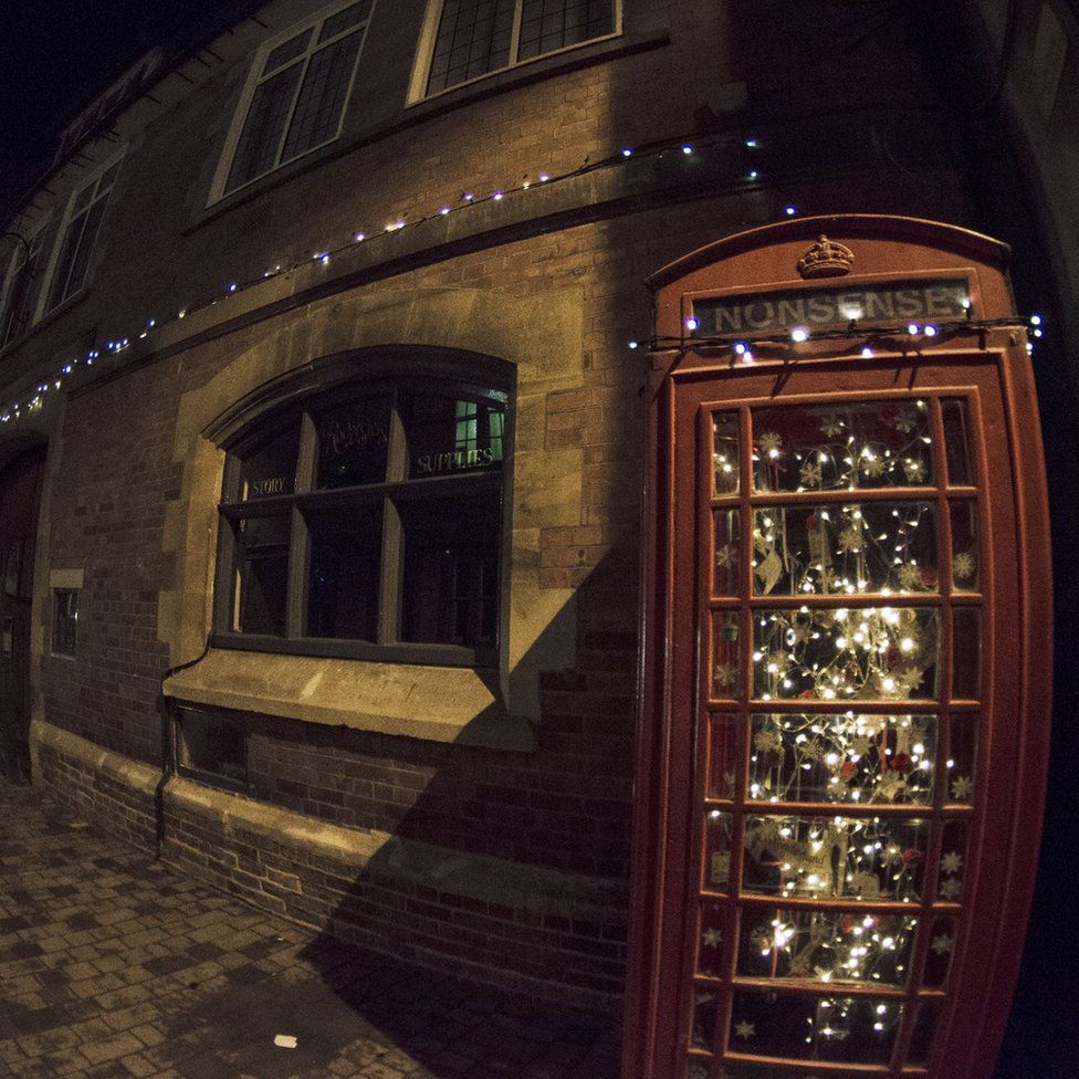 Telephone box full of Christmas lights