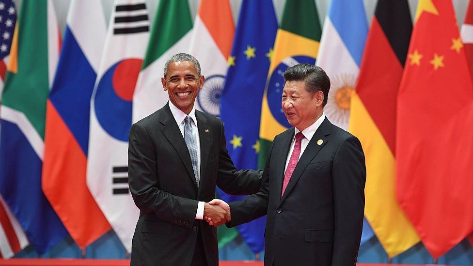 China's President Xi Jinping (R) shakes hands with US President Barack Obama before the G20 leaders' family photo in Hangzhou