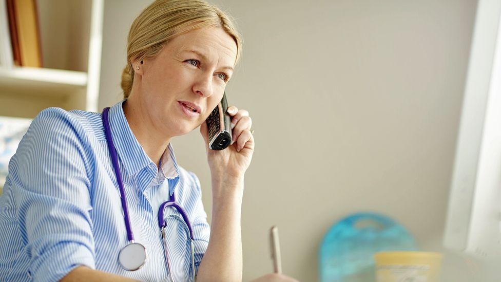 Doctor on phone (stock image)