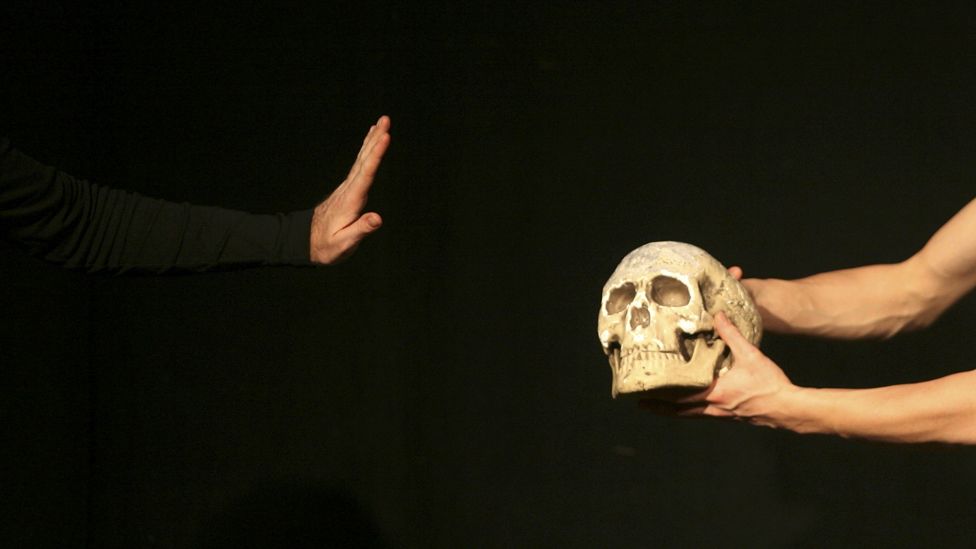 Actor holding skull