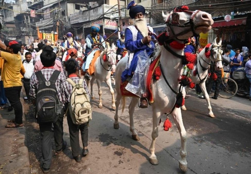 A Nihang - a Sikh warrior- rides his horse through New Delhi