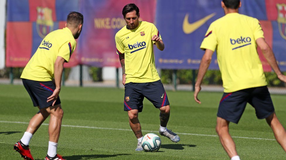 Lionel Messi of FC Barcelona controls the ball during a training session