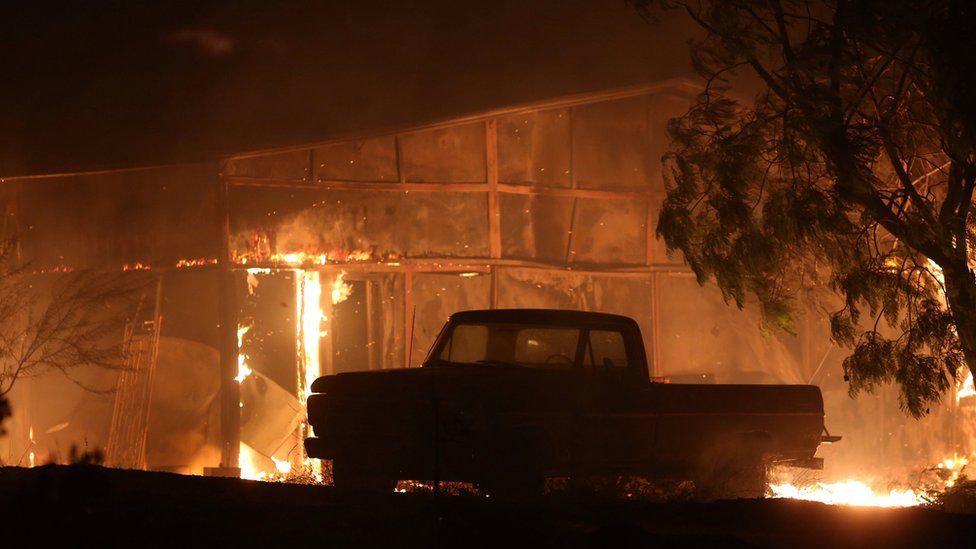A structure burns as strong winds push the Thomas Fire across thousands of acres near Santa Paula, California, U.S., December 5, 2017