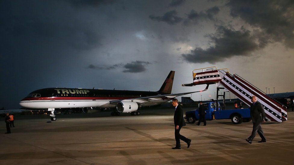 Donald Trump"s plane arrives at a Florida airport hanger for a rally the day after his first debate with Hillary Clinton on September 27, 2016 in Melbourne, Florida