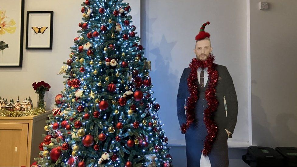 Christmas tree and cardboard cut out of Tom Hardy