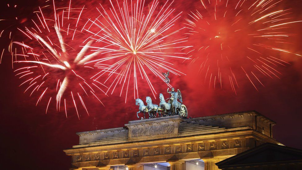 Fireworks explode over the Quadriga statue atop the Brandenburg Gate on New Year"s Eve on January 1, 2012 in Berlin, Germany.