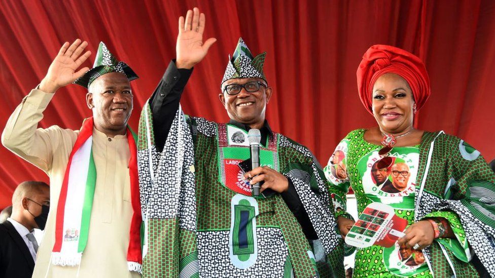 Labour Party's Presidential candidate Peter Obi (C), flanked by wife Margaret (R) and his running mate Yusuf Datti Baba-Ahmed
