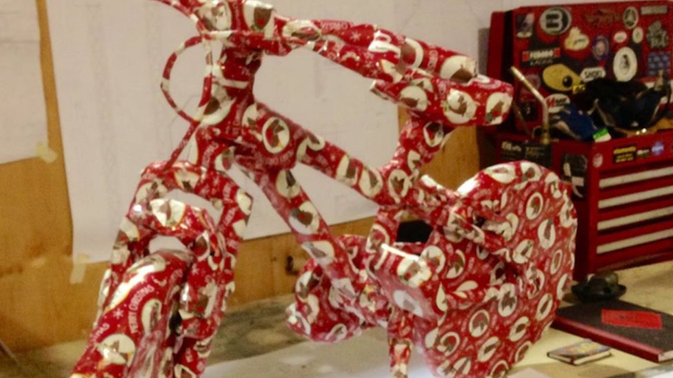 Bike wrapped in Christmas wrapping paper