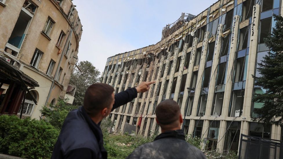 Emergency services inspect damaged buildings in Lviv