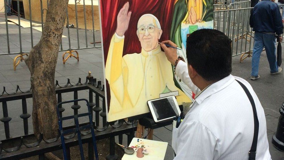 Street painter painting Pope Francis