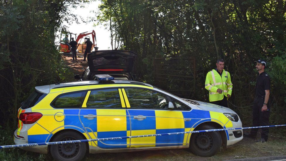 Police officers search an area near Pershore in Worcestershire