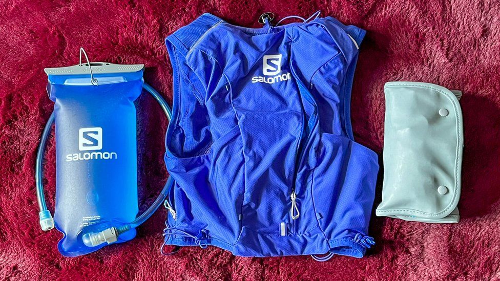 the blue vest and a later water bag and a large plastic pouch