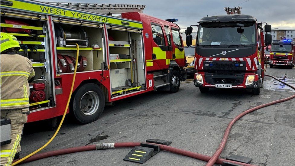 Firefighters tackle blaze at Bradford upholstery shop - BBC News