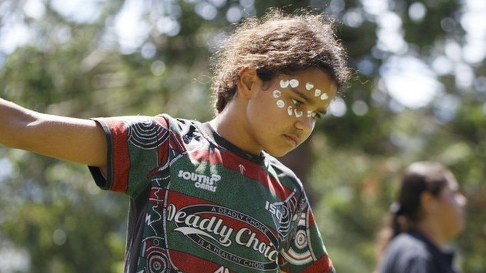 A kid performs a traditional dance at Musgrave Park during the rally. Indigenous Yuggera and Turrbal people organised a rally known as Meanjin on a date synonymous with the beginning of British colonial rule and oppression of Aboriginal people.